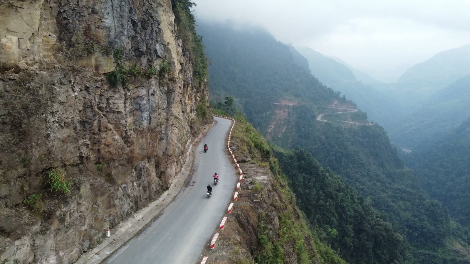 Dramatic limestone karst mountains and winding roads of the Ha Giang Loop in Vietnam